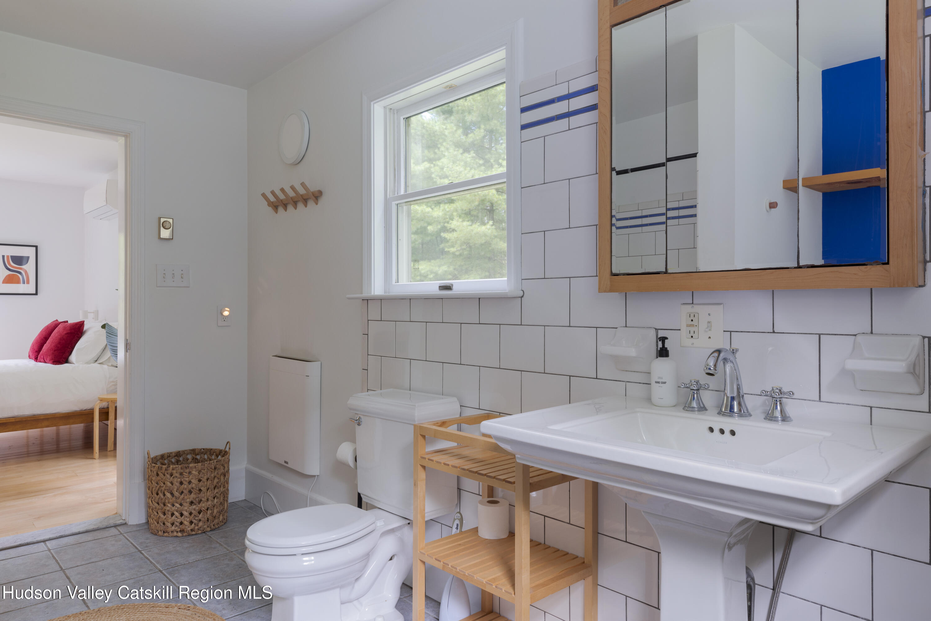 31 Joy Ridge Saugerties, NY 12477 - Photo 13 of 39 a bathroom with a sink toilet and mirror