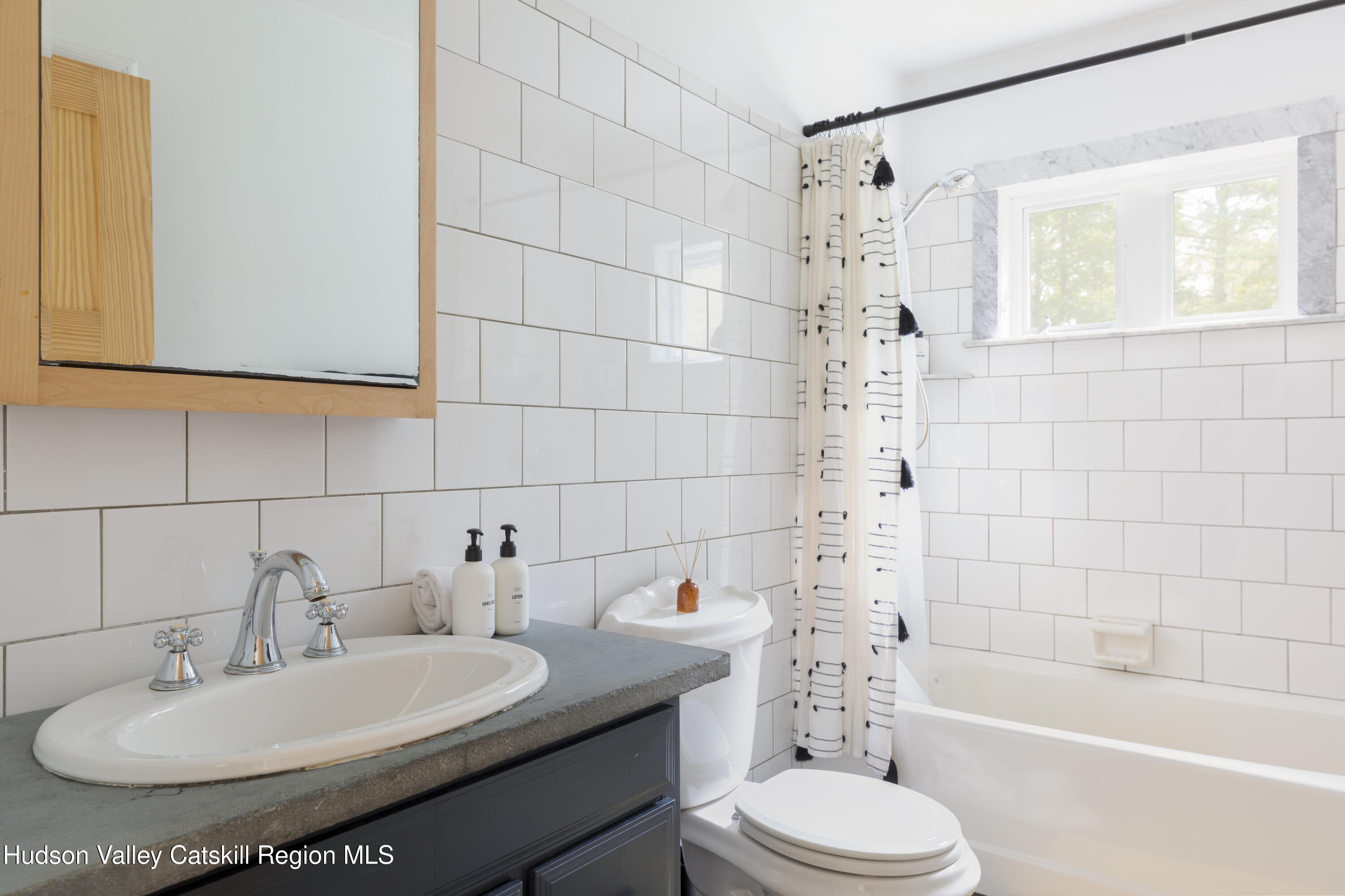 31 Joy Ridge Saugerties, NY 12477 - Photo 16 of 39 a bathroom with a sink a toilet and shower