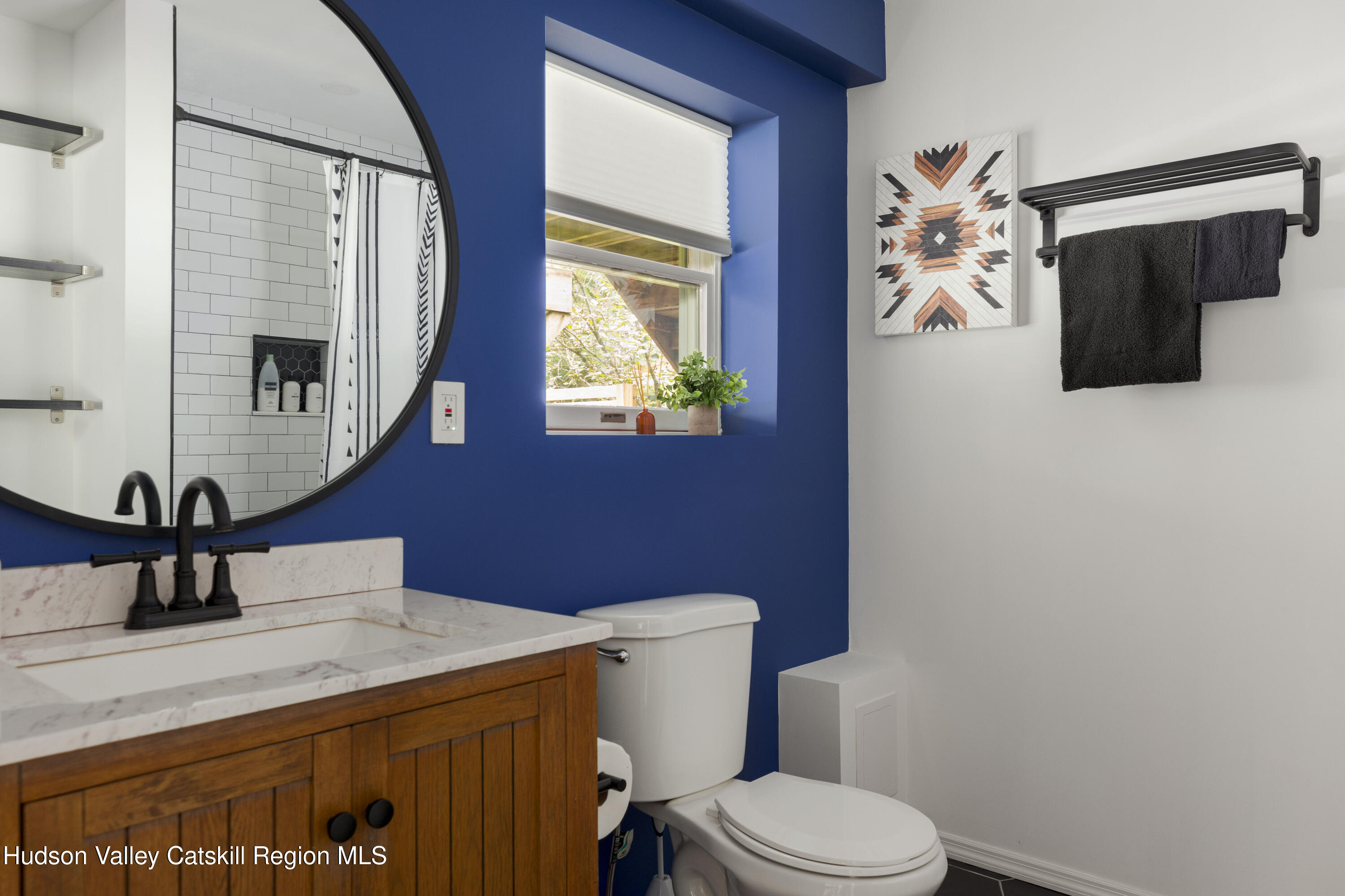 31 Joy Ridge Saugerties, NY 12477 - Photo 20 of 39 a bathroom with a sink a toilet and mirror