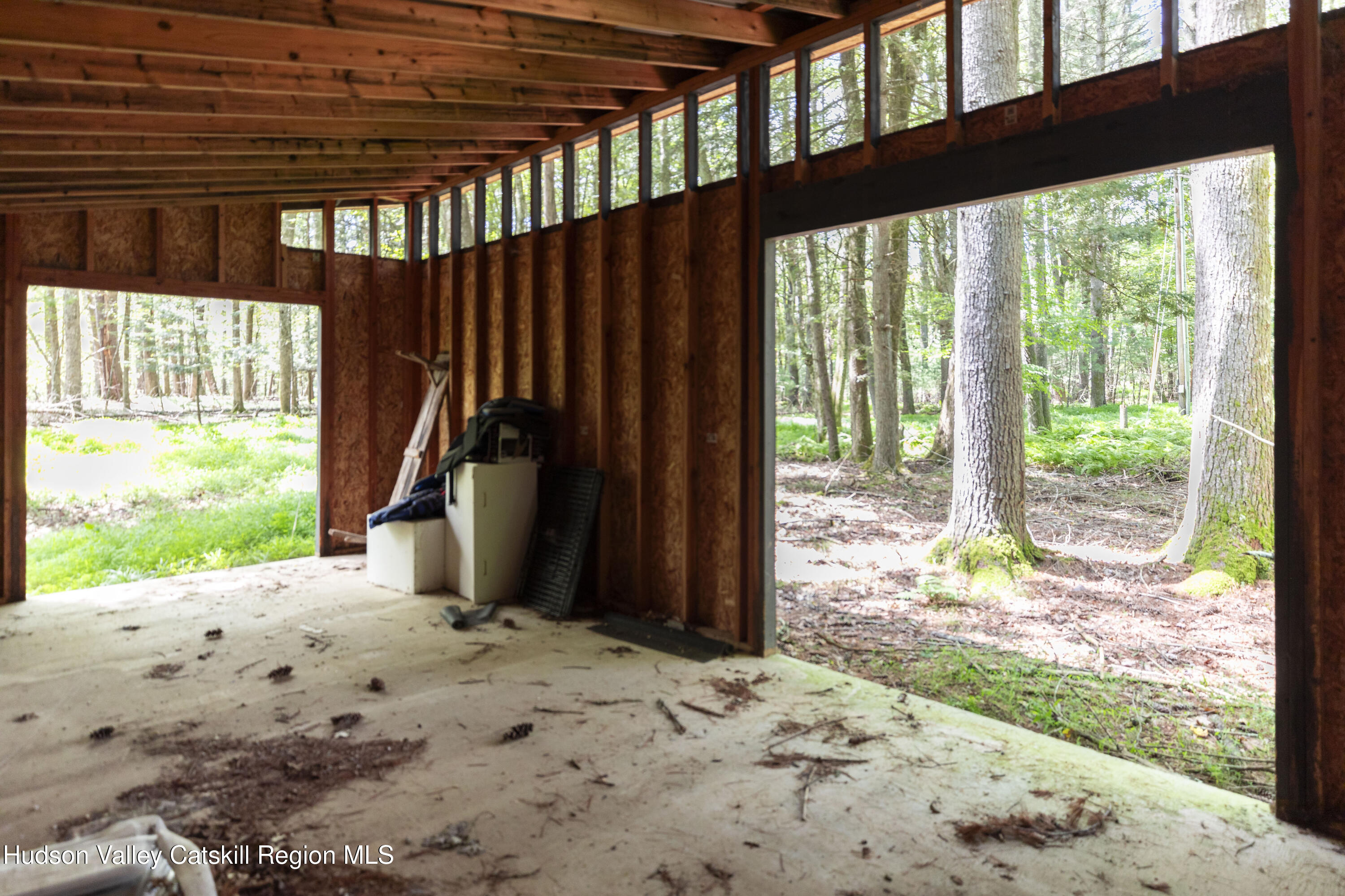 31 Joy Ridge Saugerties, NY 12477 - Photo 38 of 39 a view of a backyard with large trees and plants