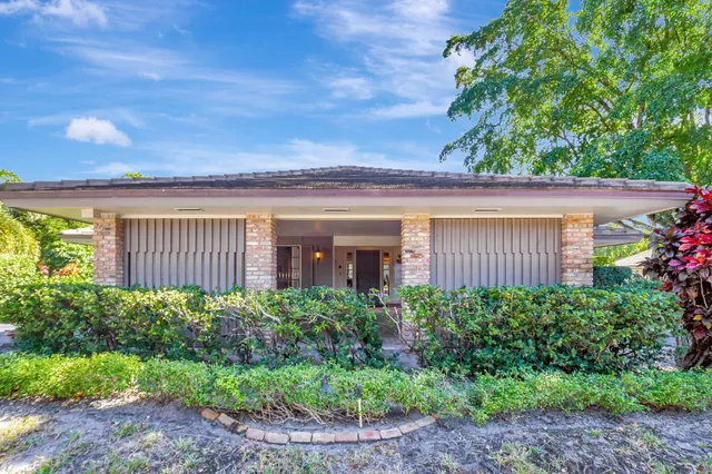 a view of a garden from a balcony