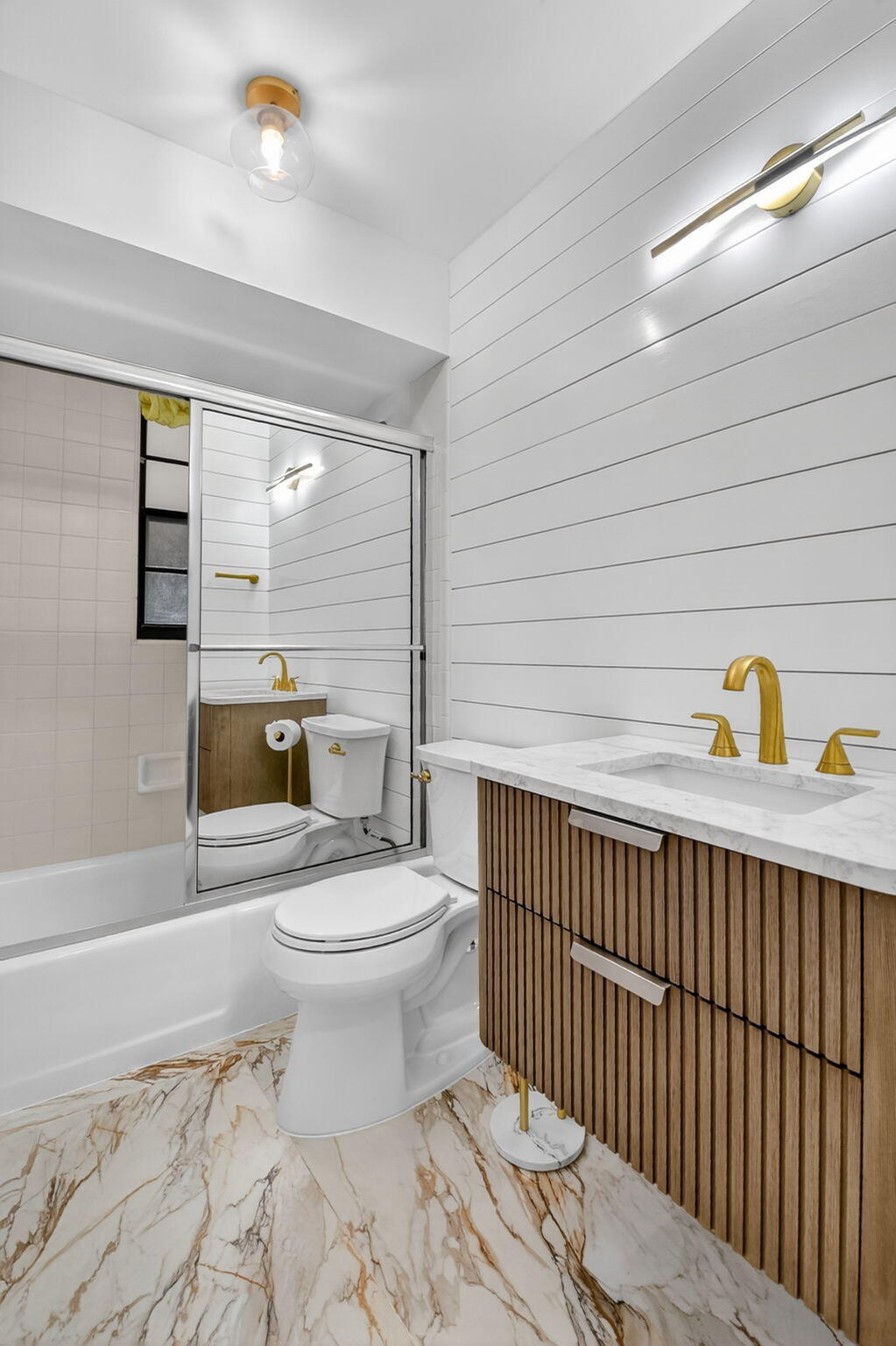 600 Cypress Key Drive Atlantis, FL 33462 - Photo 23 of 43 a bathroom with a toilet a sink and bathtub