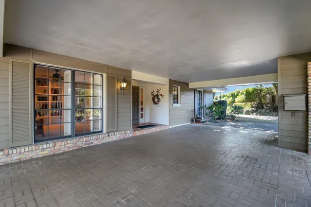 a view of livingroom with wooden floor and floor to ceiling window