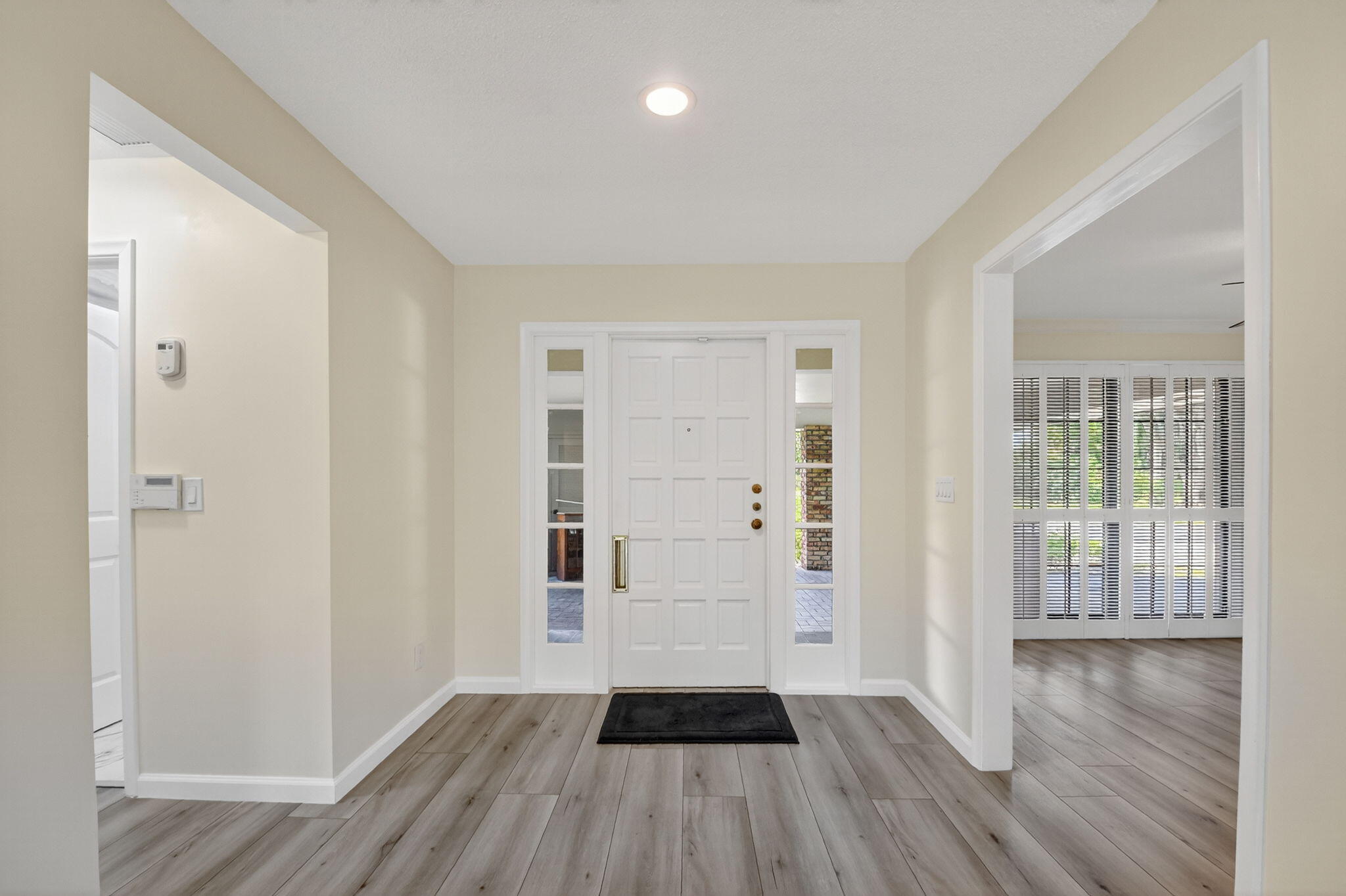 600 Cypress Key Drive Atlantis, FL 33462 - Photo 36 of 43 wooden floor in an empty room with a window