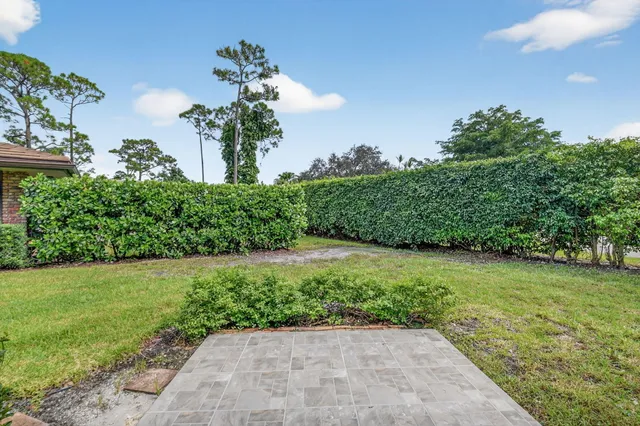 a front view of a house with a yard and porch
