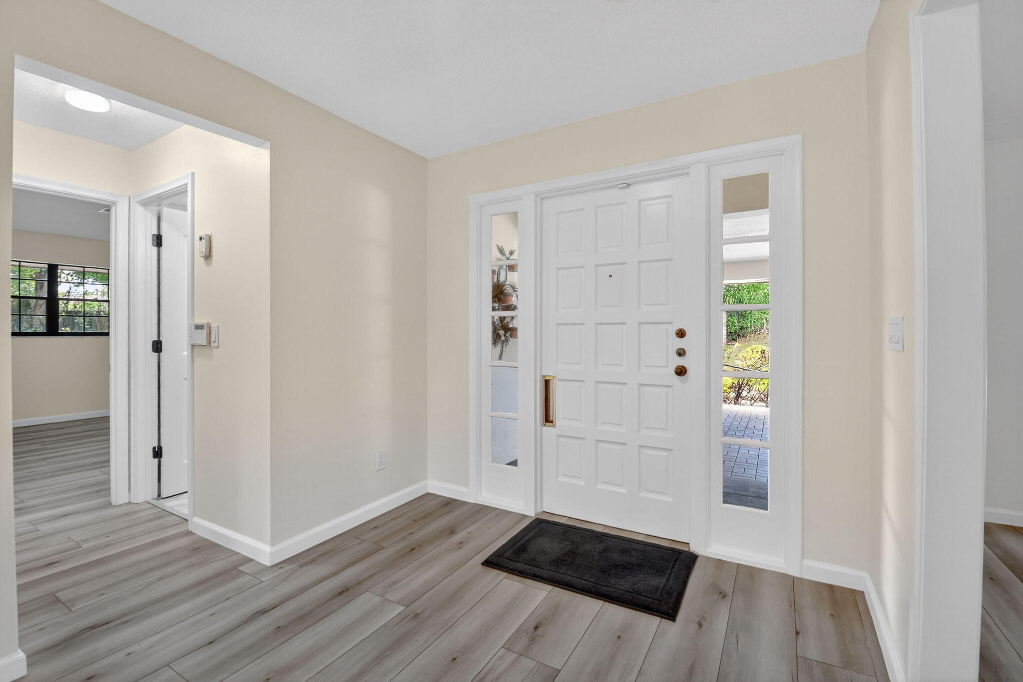 600 Cypress Key Drive Atlantis, FL 33462 - Photo 6 of 43 wooden floor in an empty room