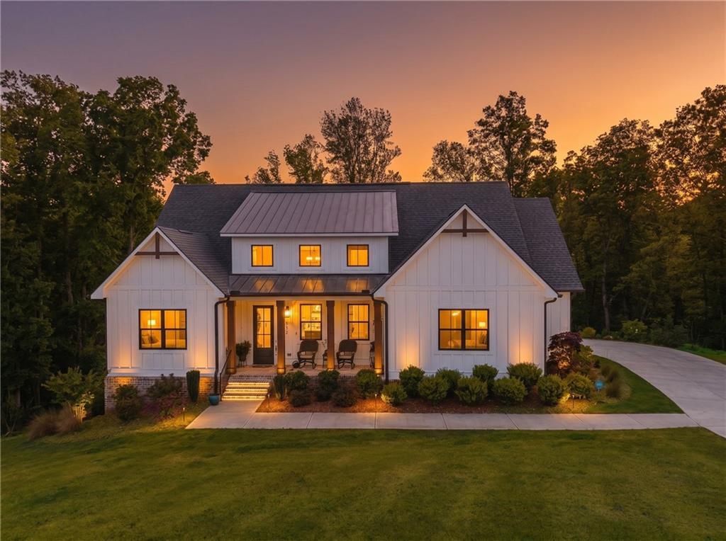 392 London Road Ball Ground, GA 30107 - Photo 5 of 53 a front view of a house with swimming pool having outdoor seating