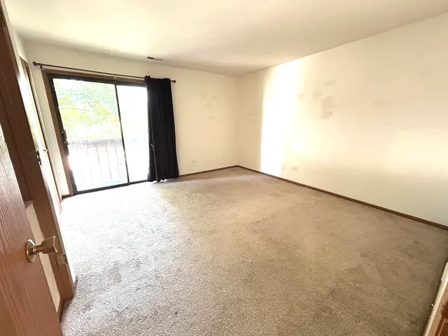 an empty room with large window