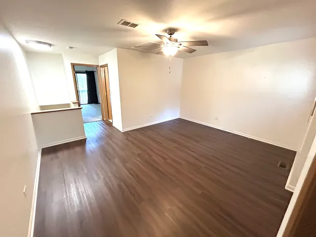 a view of a livingroom with wooden floor