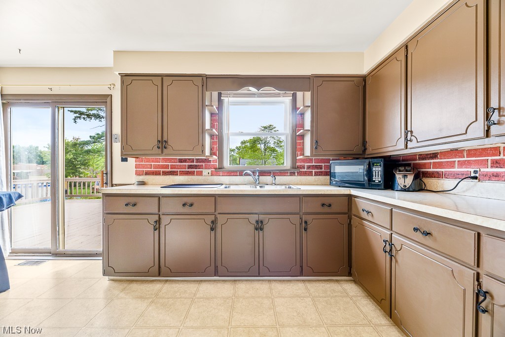 2905 Brunswick Road Youngstown, OH 44511 - Photo 7 of 35 Kitchen with light countertops, a healthy amount of sunlight