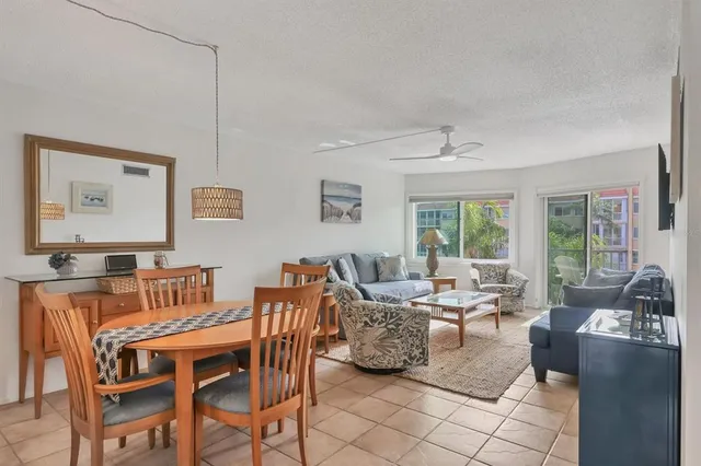 a bedroom with a bed and large window