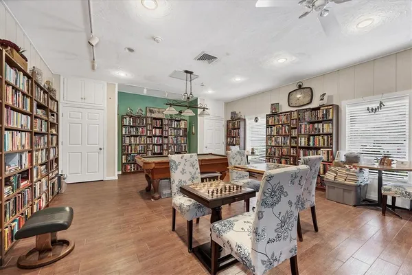 a living room with a sink furniture and a clock
