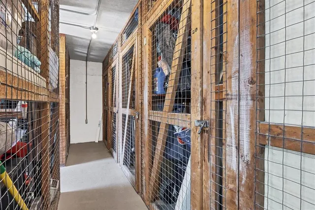 a view of a swimming pool with a bench and lawn chairs