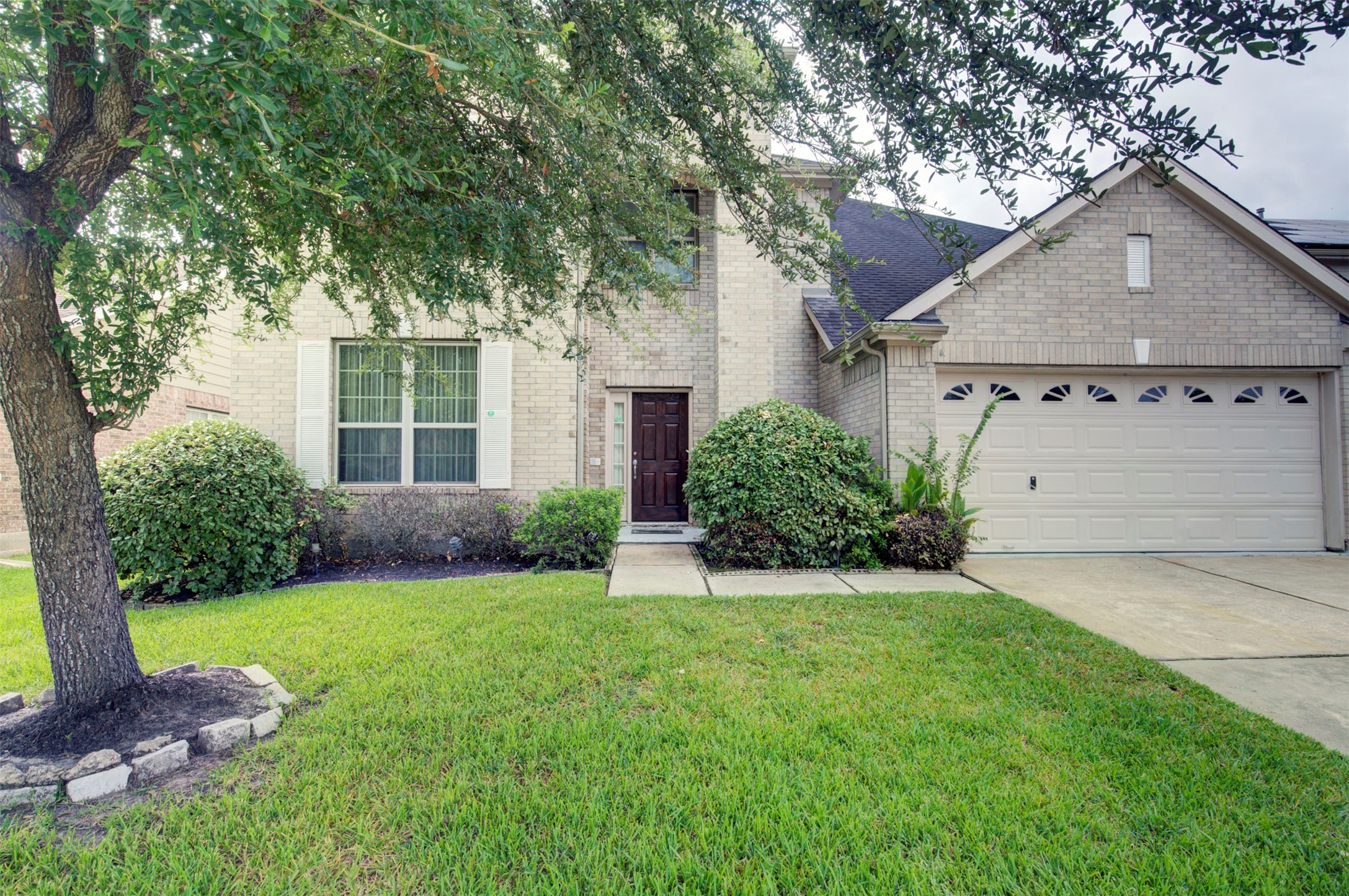 29642 Legends Green Drive Spring, TX 77386 - Photo 1 of 44 a front view of a house with a yard and garage