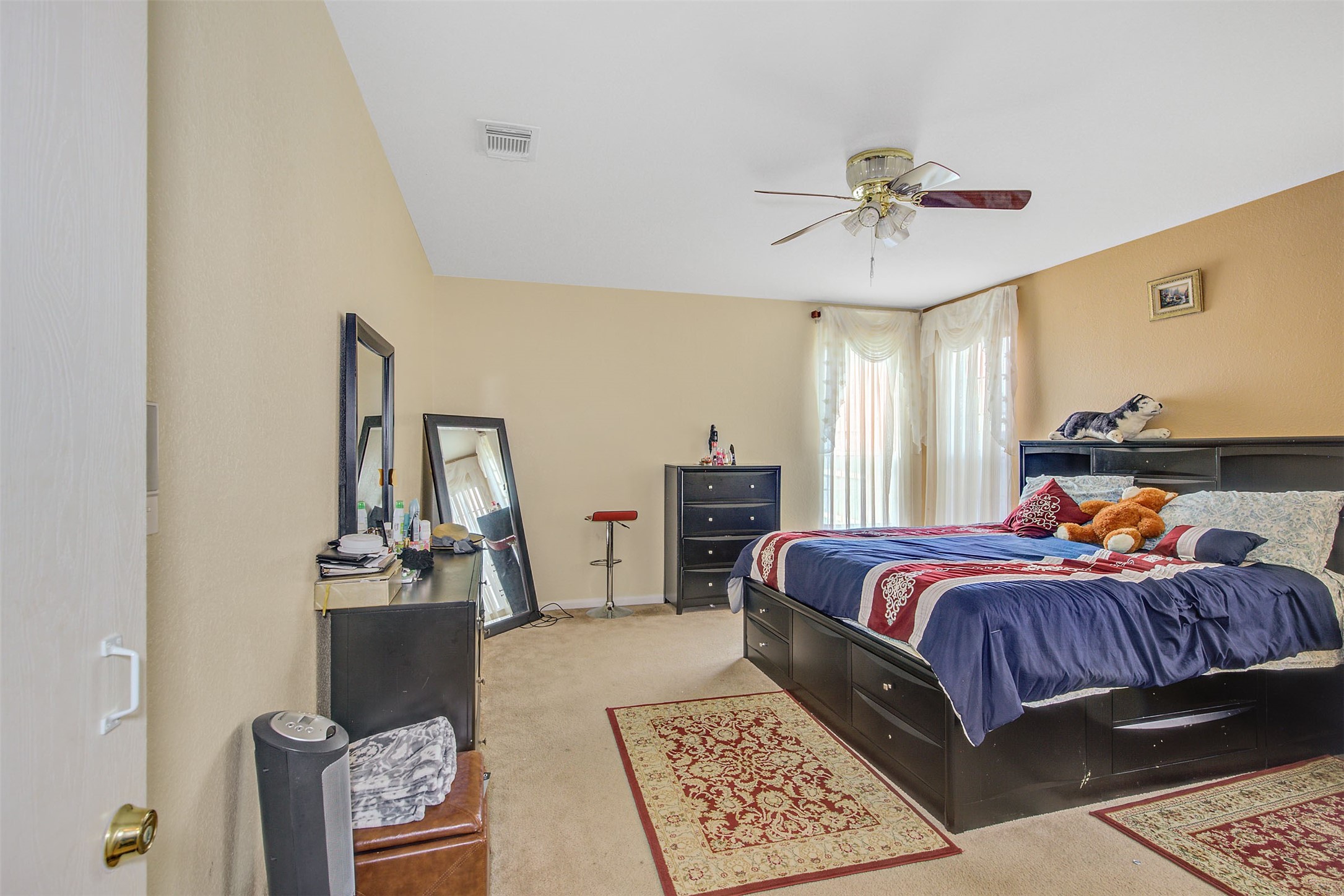 29642 Legends Green Drive Spring, TX 77386 - Photo 19 of 44 a bed room with a bed and a chandelier