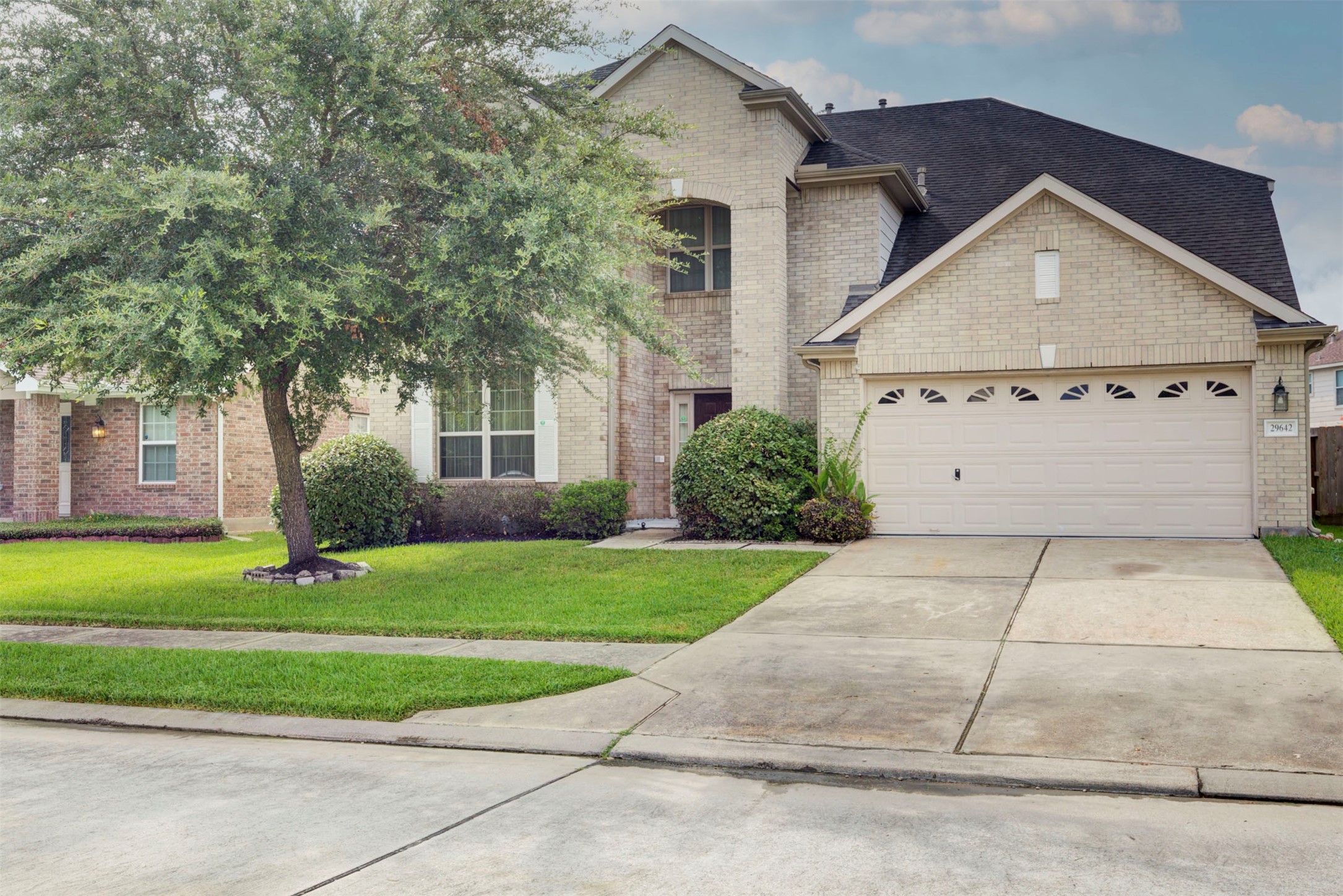 29642 Legends Green Drive Spring, TX 77386 - Photo 2 of 44 a front view of a house with a yard and garage