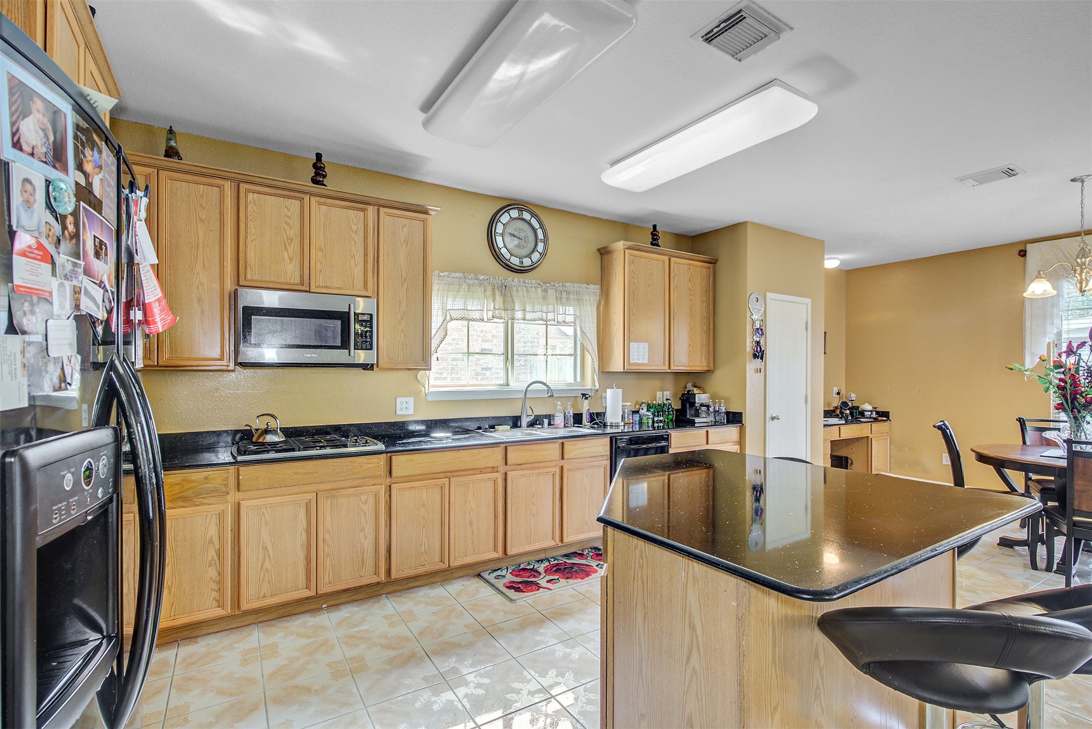 29642 Legends Green Drive Spring, TX 77386 - Photo 5 of 44 a kitchen with stainless steel appliances granite countertop a sink a stove and a refrigerator