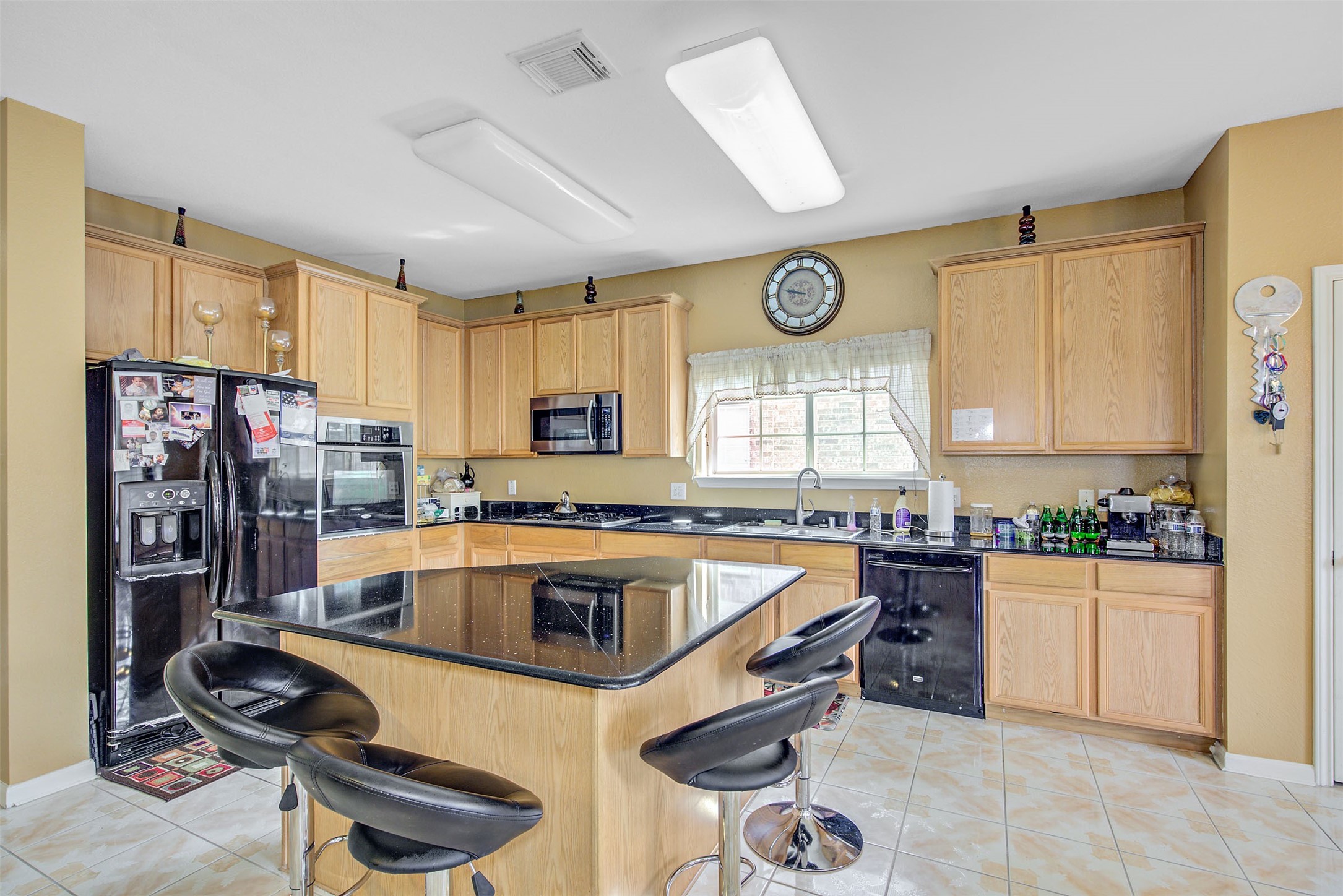 29642 Legends Green Drive Spring, TX 77386 - Photo 6 of 44 a kitchen with a stove a refrigerator and a sink