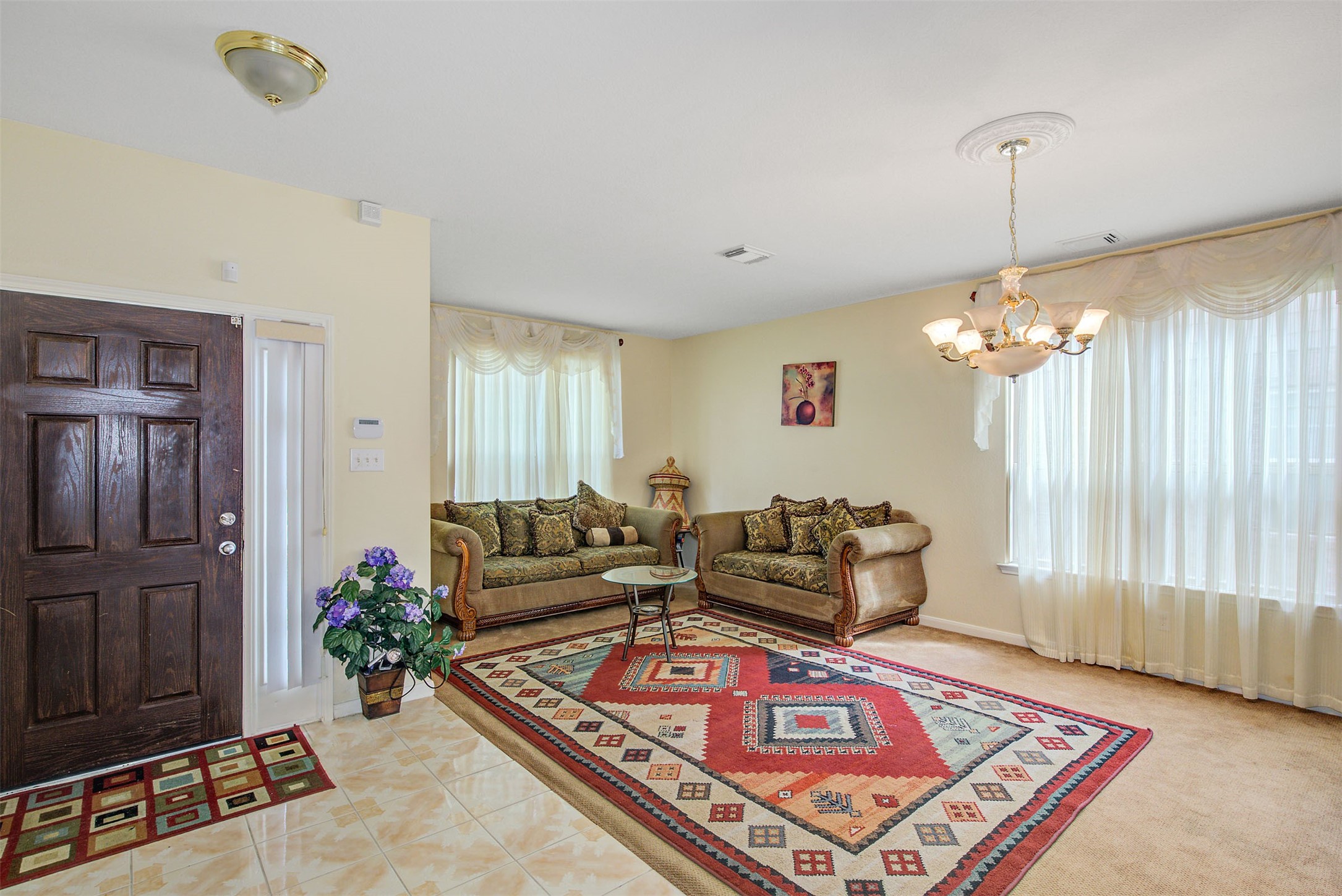 29642 Legends Green Drive Spring, TX 77386 - Photo 9 of 44 a living room with furniture and a chandelier