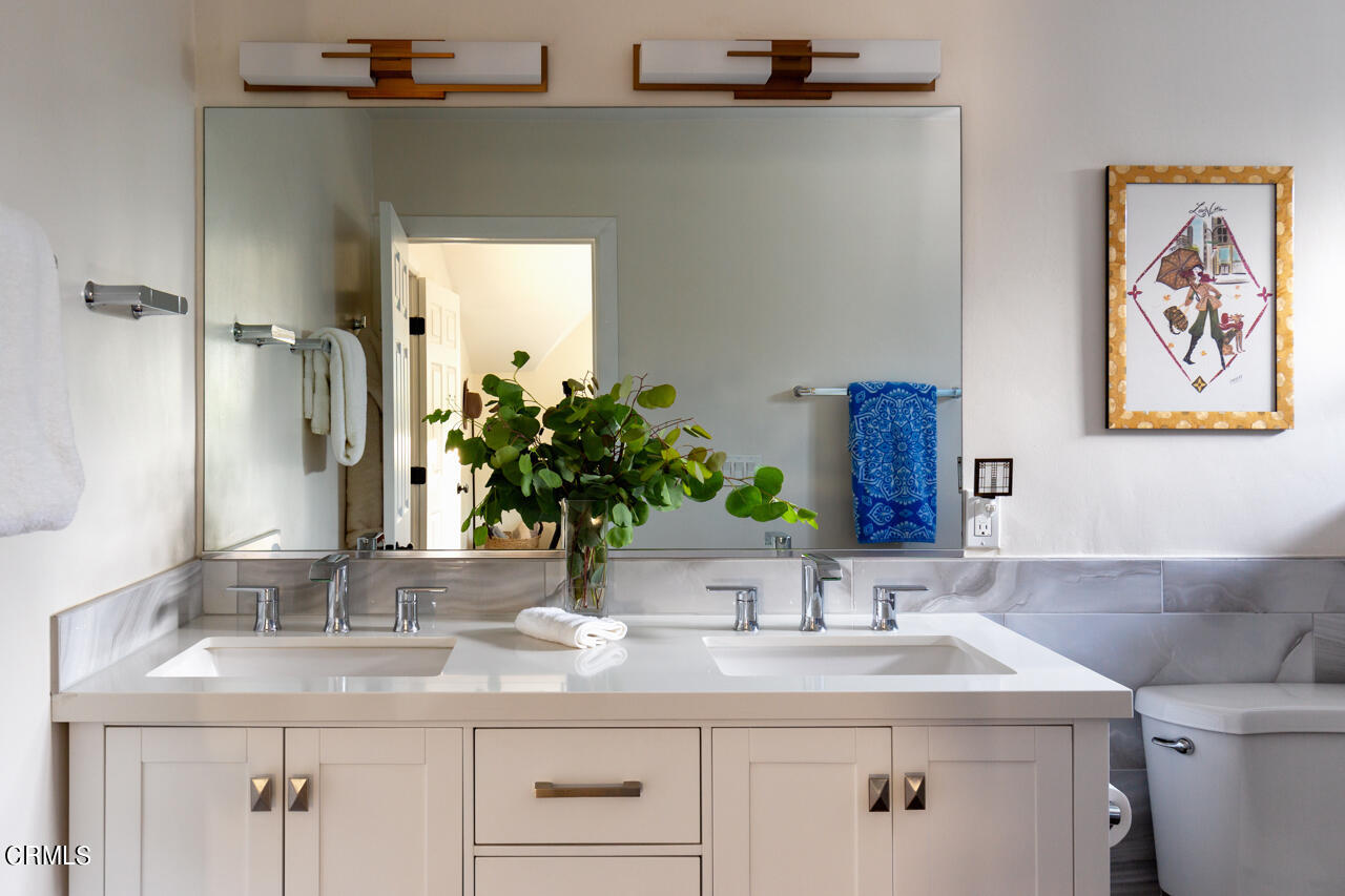 4105 Aralia Road Altadena, CA 91001 - Photo 18 of 41 a bathroom with a sink and a mirror