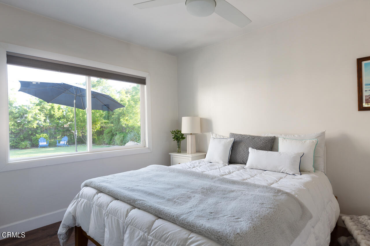 4105 Aralia Road Altadena, CA 91001 - Photo 20 of 41 a bedroom with a bed and a large window