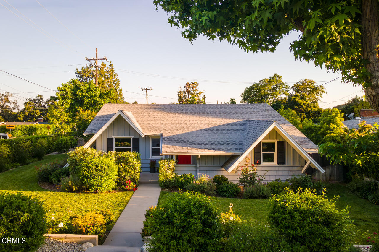 4105 Aralia Road Altadena, CA 91001 - Photo 2 of 41 a front view of a house with a yard and potted plants