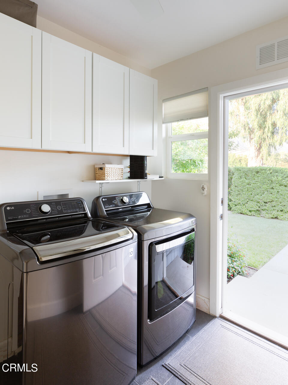 4105 Aralia Road Altadena, CA 91001 - Photo 23 of 41 a kitchen with stainless steel appliances granite countertop a stove a sink and white cabinets