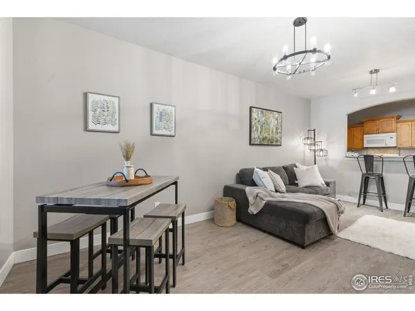 a bedroom with furniture and a chandelier
