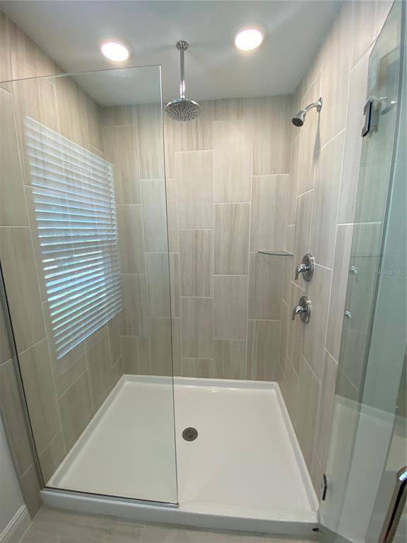 435 Lemongrass Road Minneola, FL 34715 - Photo 11 of 21 a bathroom with a shower