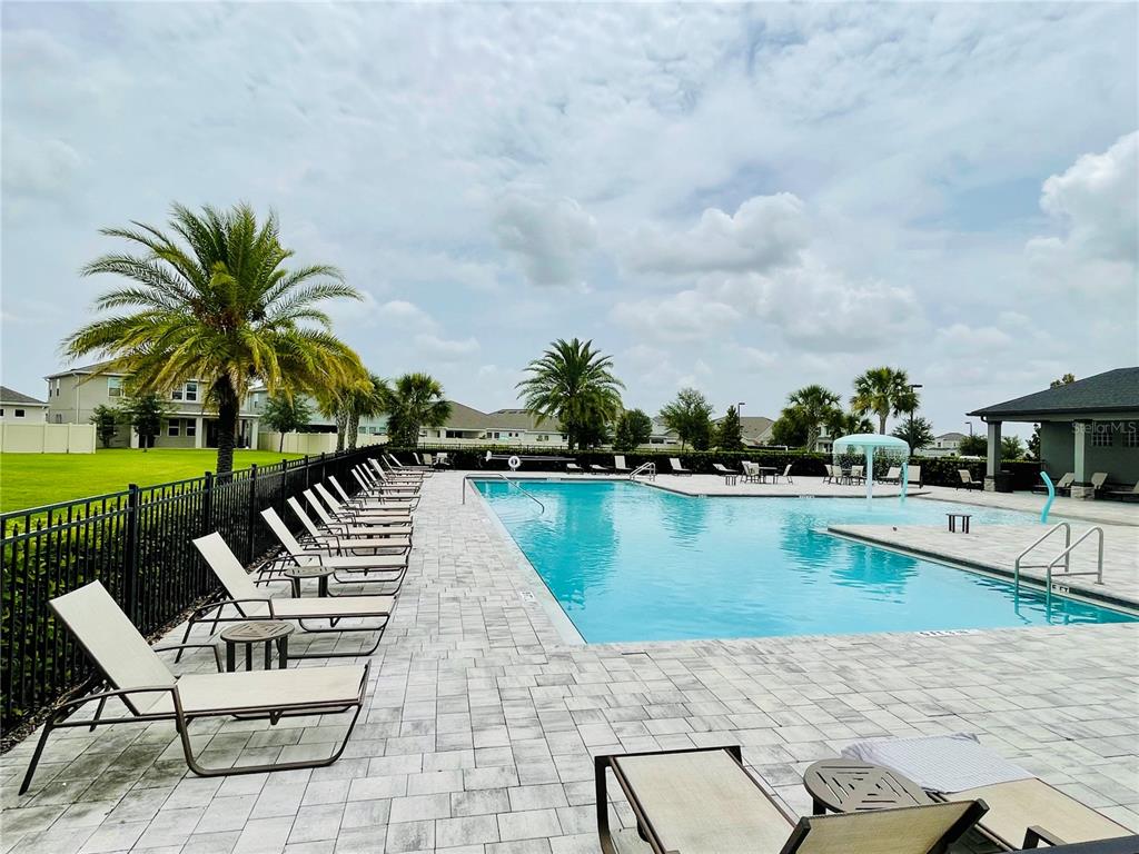 435 Lemongrass Road Minneola, FL 34715 - Photo 19 of 21 an outdoor space with swimming pool and furniture