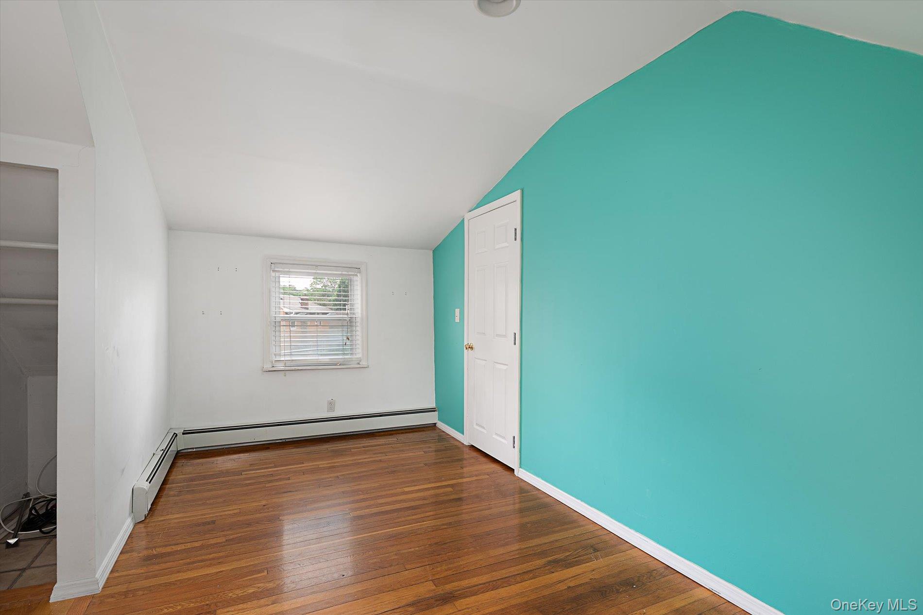675 Little E Neck Road West Babylon, NY 11704 - Photo 12 of 20 a view of a room with wooden floor and a window
