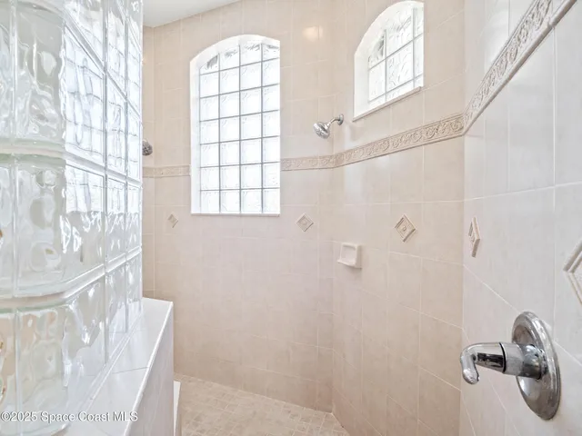 a kitchen with stainless steel appliances granite countertop a stove and a refrigerator