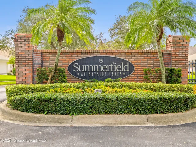a front view of a building with swimming pool