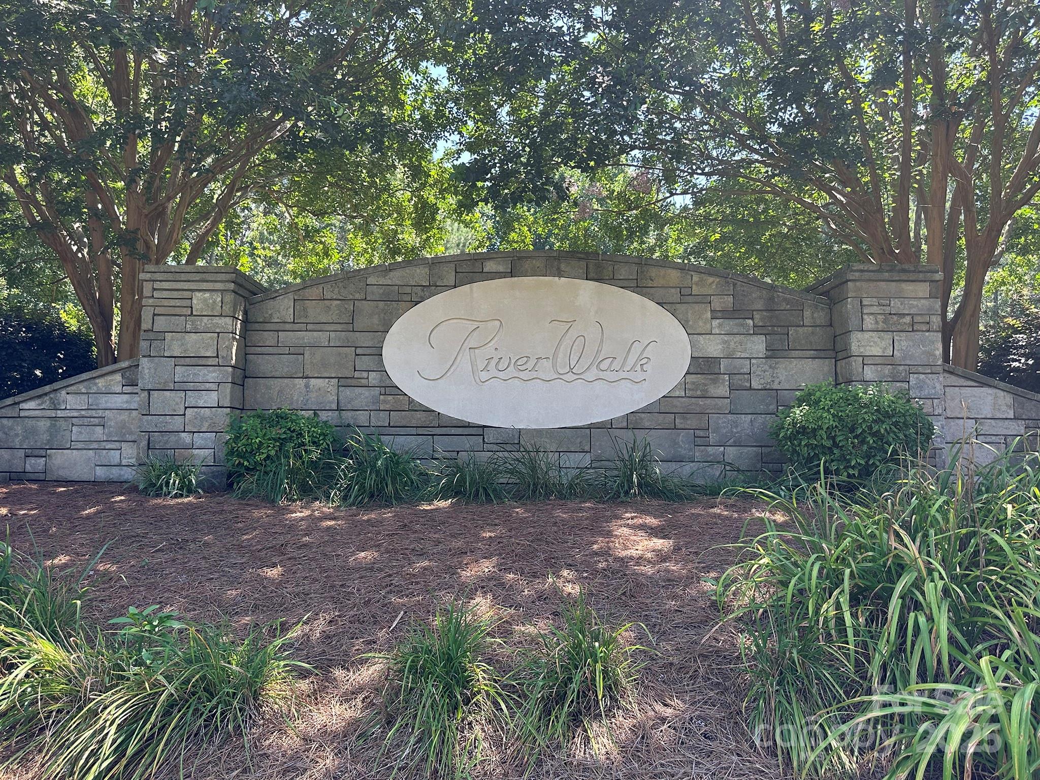 547 Stewart Rock Road Stony Point, NC 28678 - Photo 18 of 29 a view of a backyard with a small yard and large trees