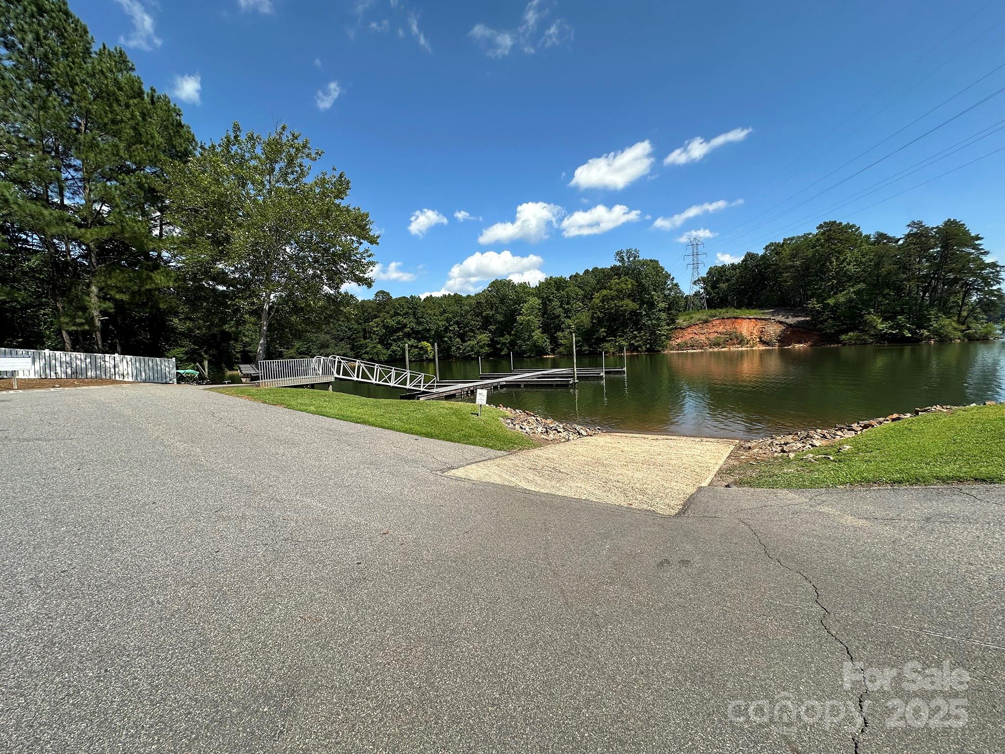 547 Stewart Rock Road Stony Point, NC 28678 - Photo 27 of 29 a view of a lake with a yard