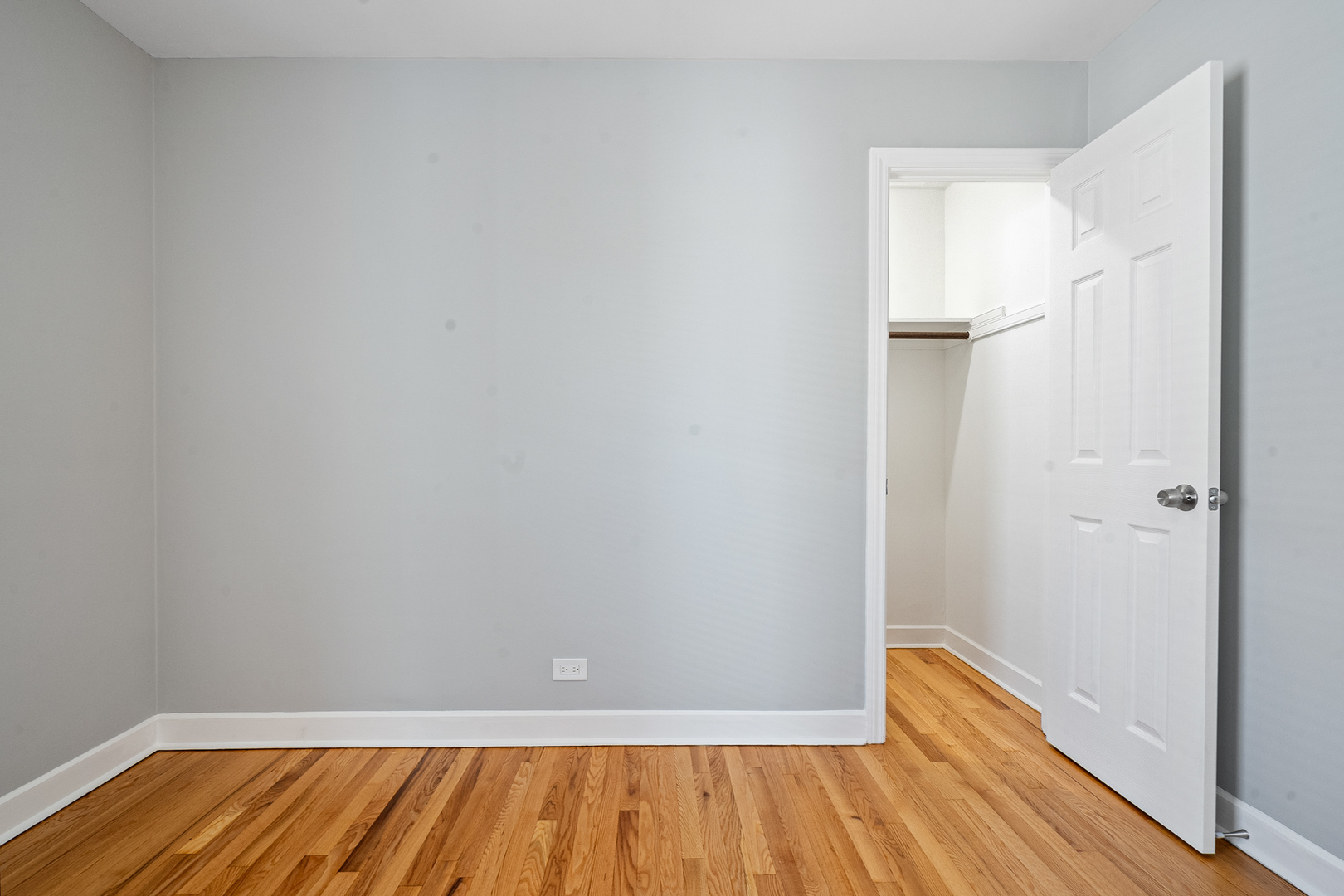 604 Dodge Avenue Evanston, IL 60202 - Photo 13 of 26 a view of a room with wooden floor and a staircase
