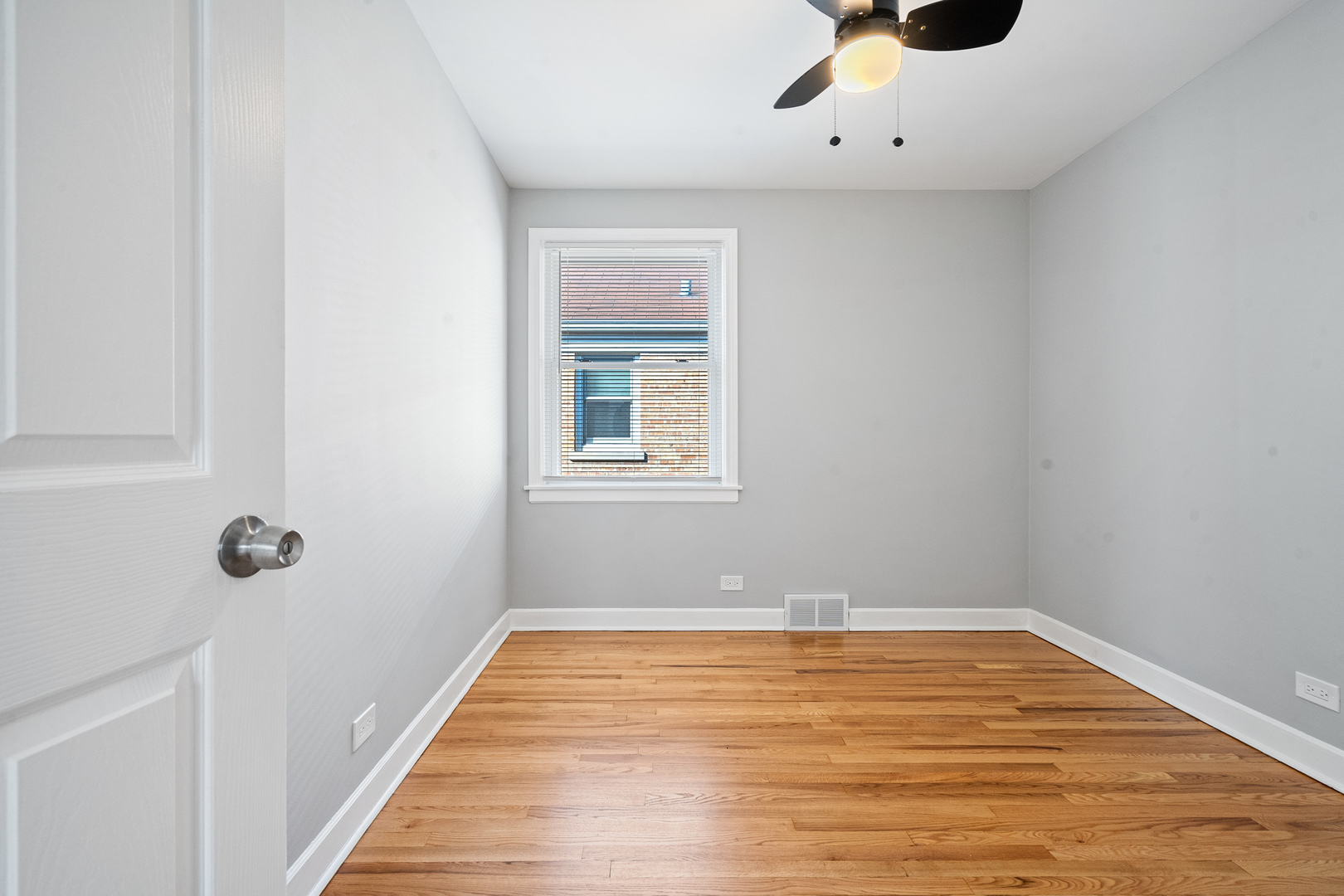 604 Dodge Avenue Evanston, IL 60202 - Photo 15 of 26 a view of a room with wooden floor and white walls