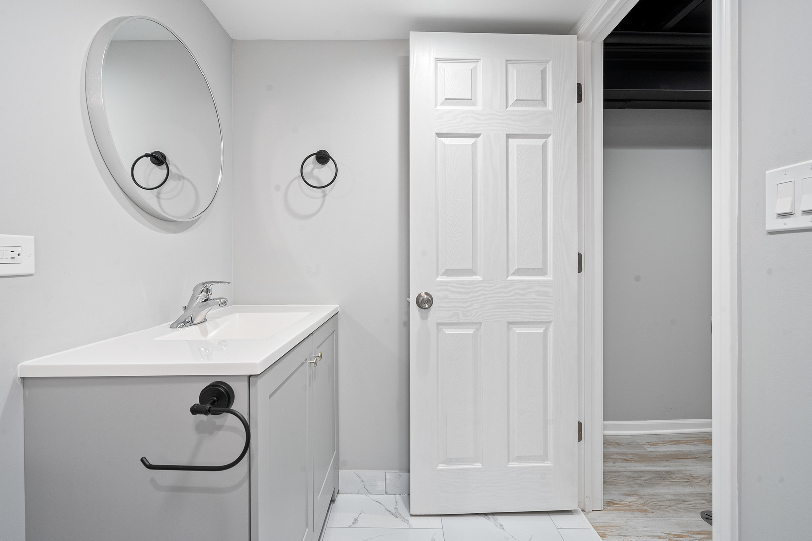 604 Dodge Avenue Evanston, IL 60202 - Photo 17 of 26 a bathroom with a sink and a mirror