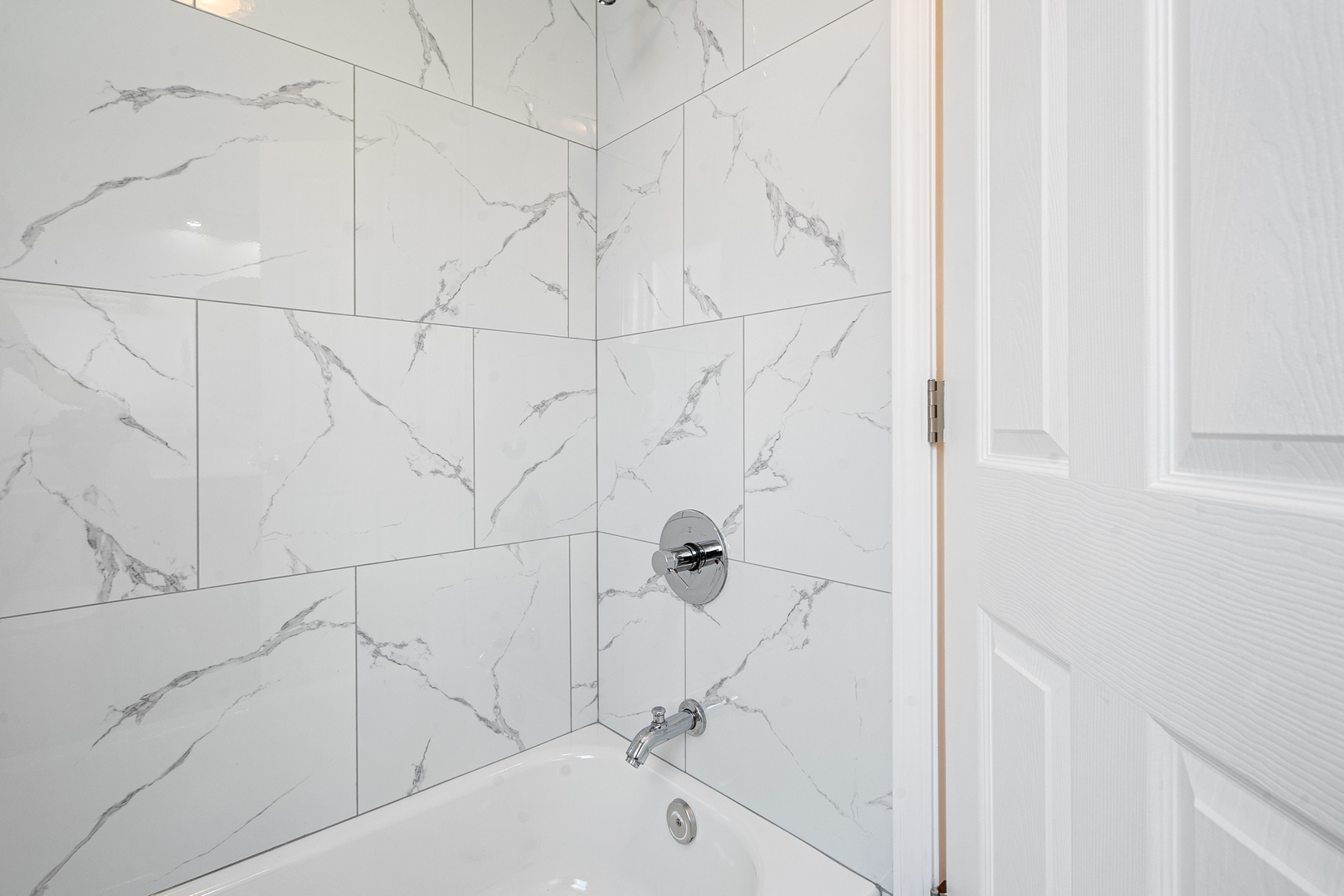 604 Dodge Avenue Evanston, IL 60202 - Photo 19 of 26 a bathroom with a bathtub and a shower