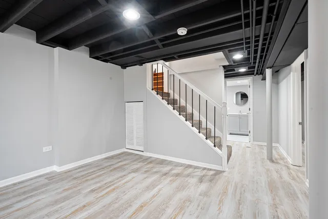 a view of staircase with wooden floor