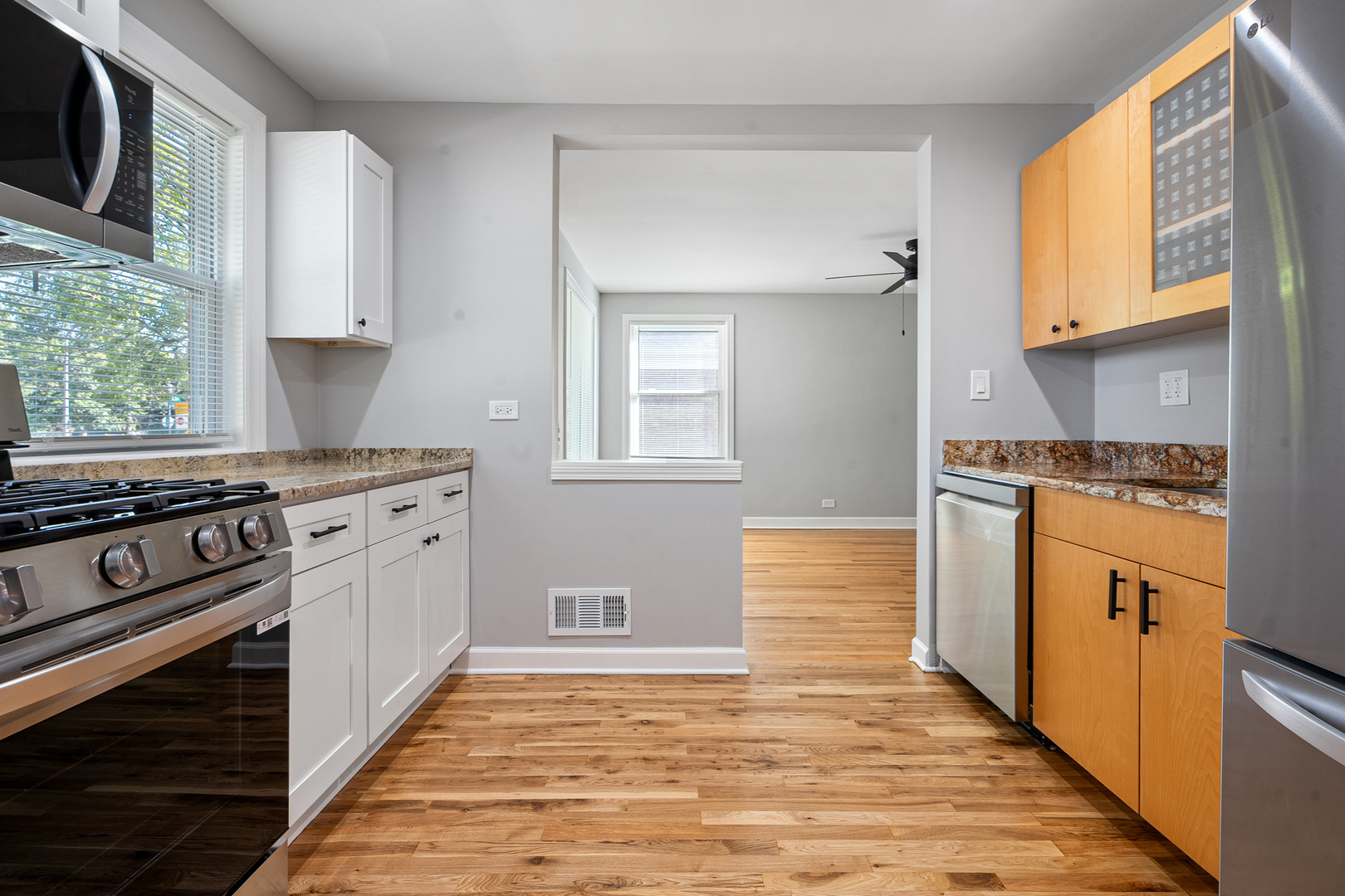 604 Dodge Avenue Evanston, IL 60202 - Photo 4 of 26 a kitchen with stainless steel appliances a stove microwave and cabinets