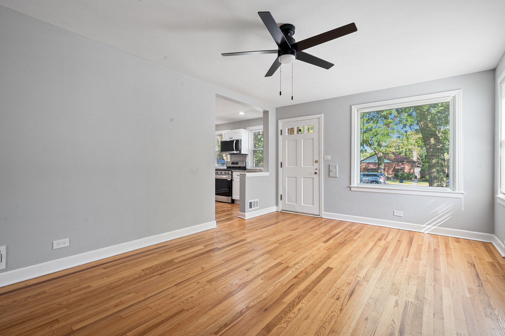 604 Dodge Avenue Evanston, IL 60202 - Photo 10 of 26 wooden floor in an empty room with a window