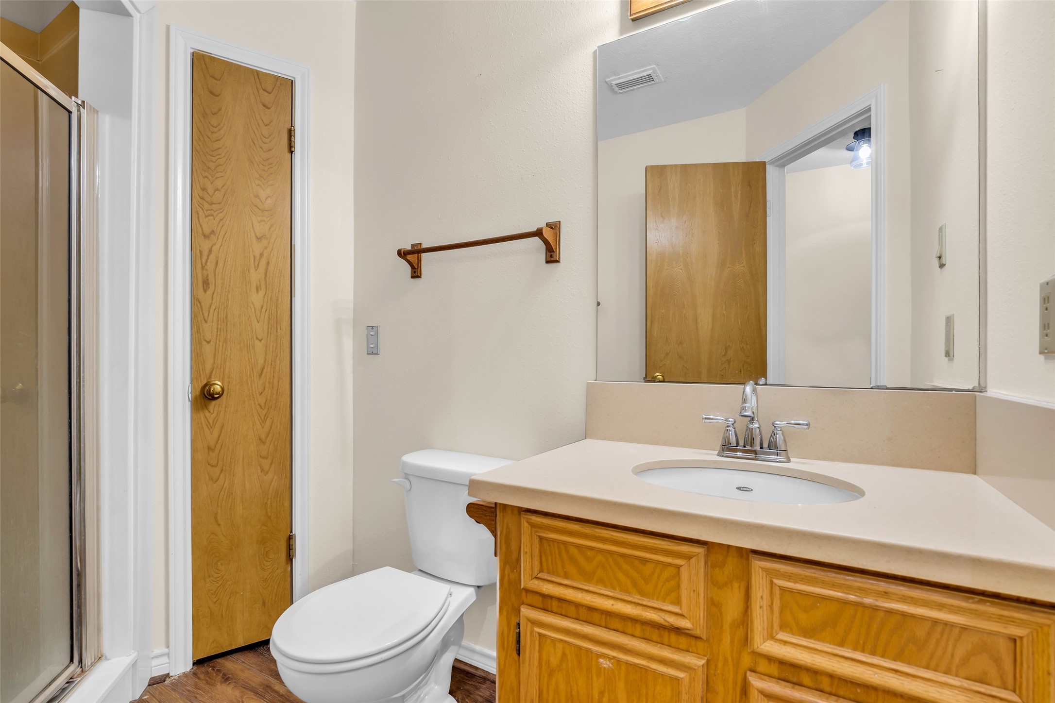 7 Lazy Spring Trinity, TX 75862 - Photo 20 of 25 Full bathroom featuring tile flooring, a wood vanity, and a shower