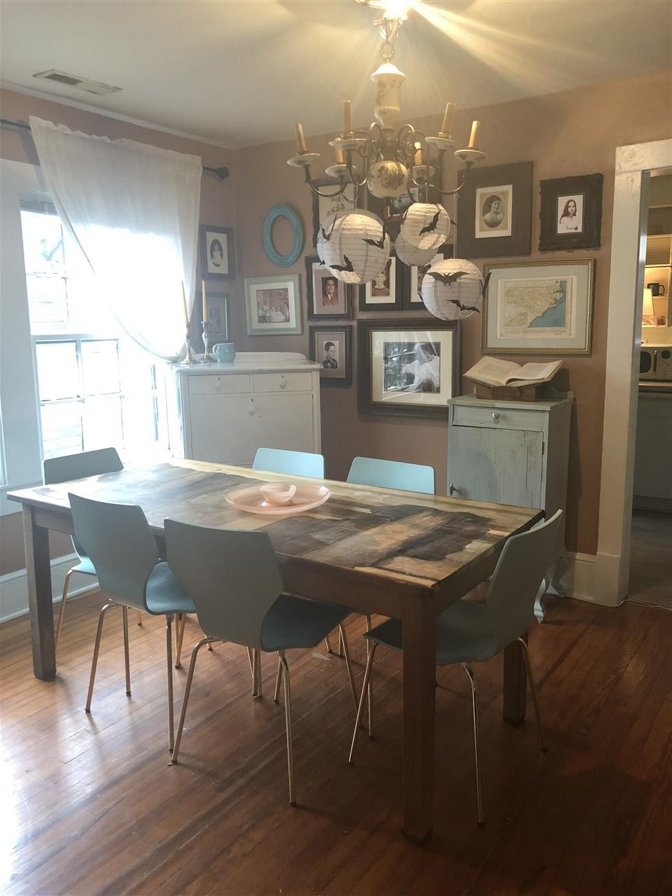 310 Chamberlain Street Raleigh, NC 27605 - Photo 4 of 9 a view of a dining room with furniture and wooden floor