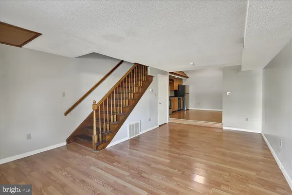 a view of an entryway with wooden floor