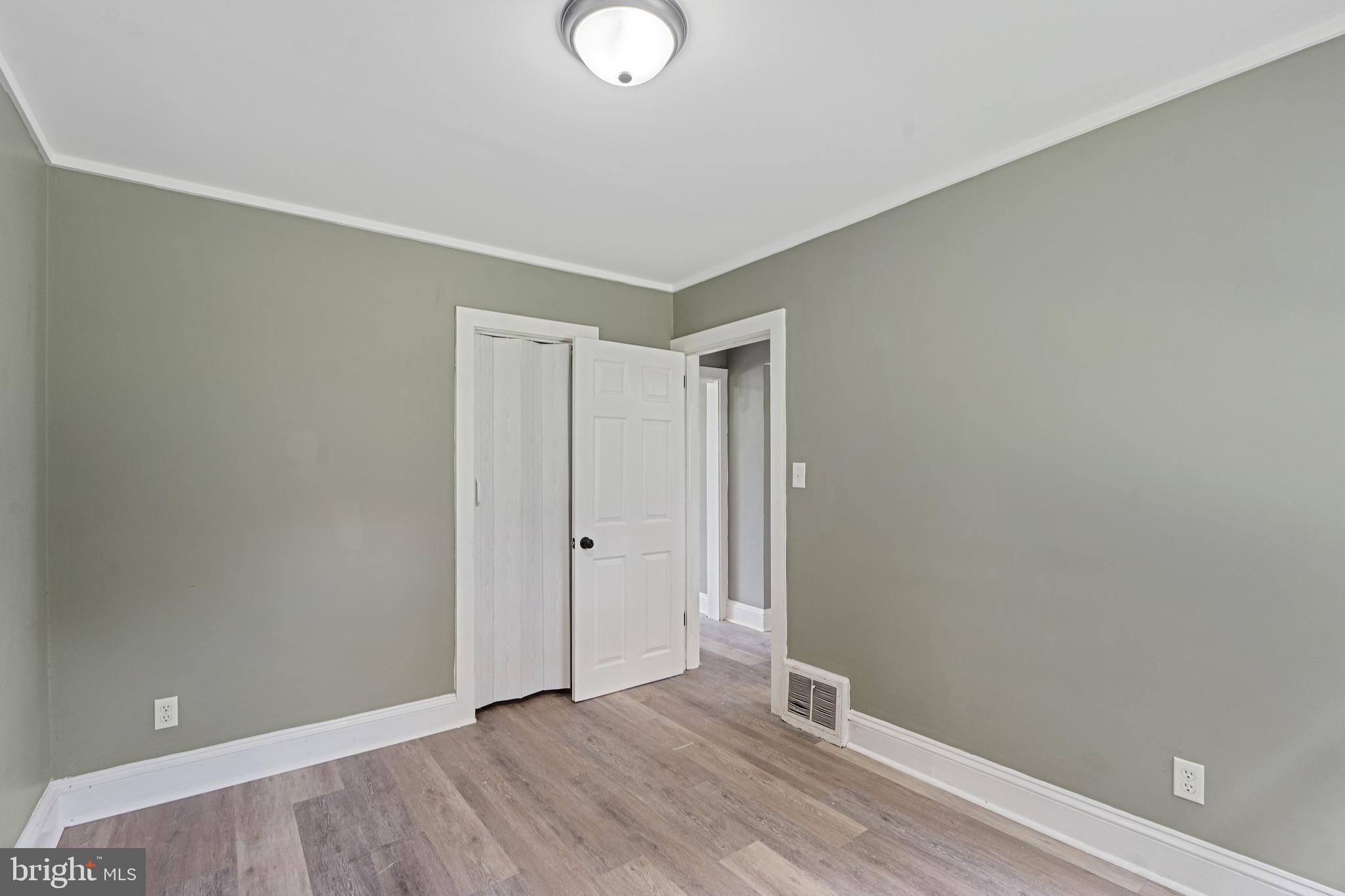 22 Davis Avenue Salem, NJ 08079 - Photo 12 of 25 a view of an empty room with wooden floor