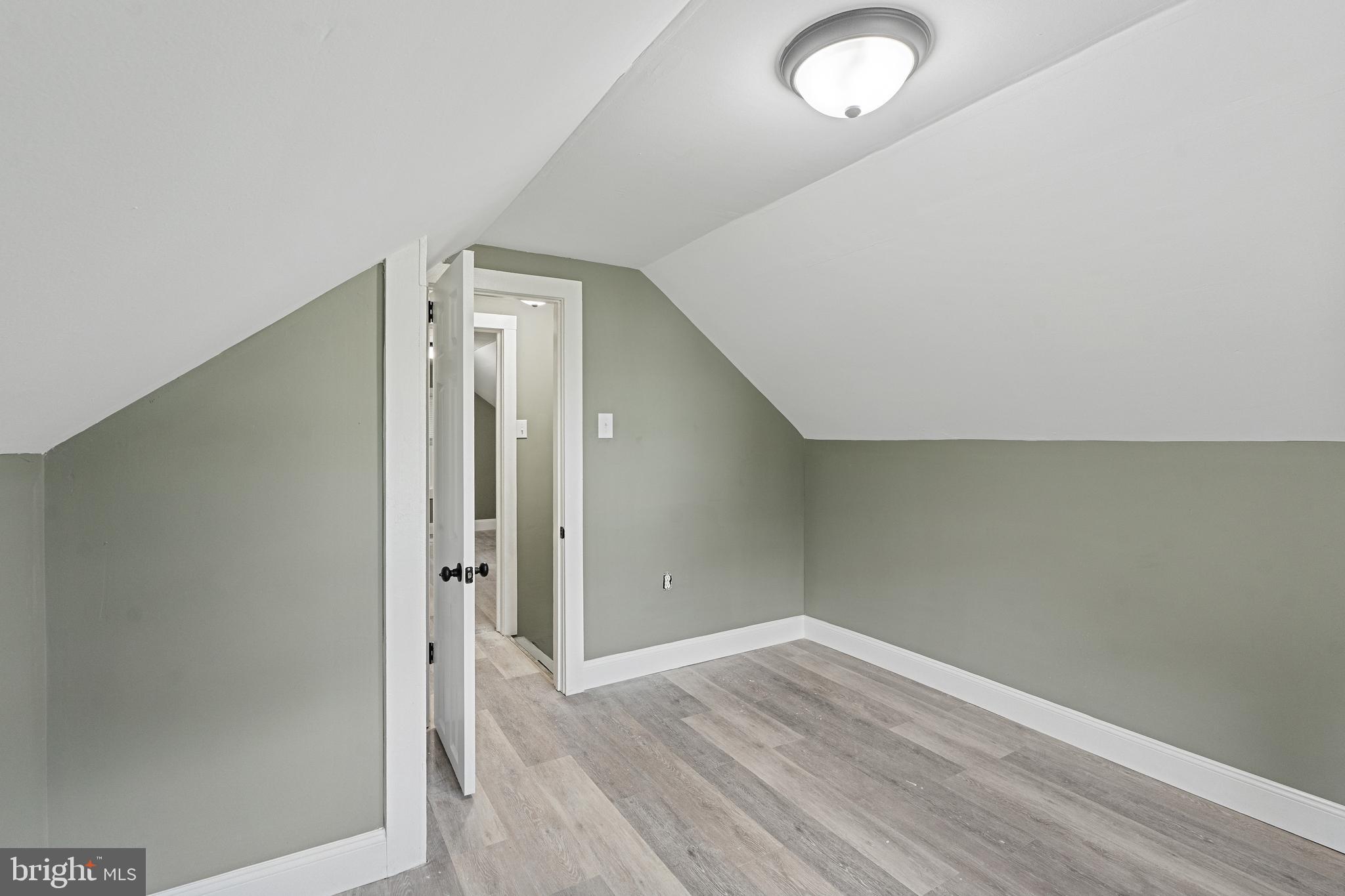 22 Davis Avenue Salem, NJ 08079 - Photo 17 of 25 an empty room with wooden floor and windows
