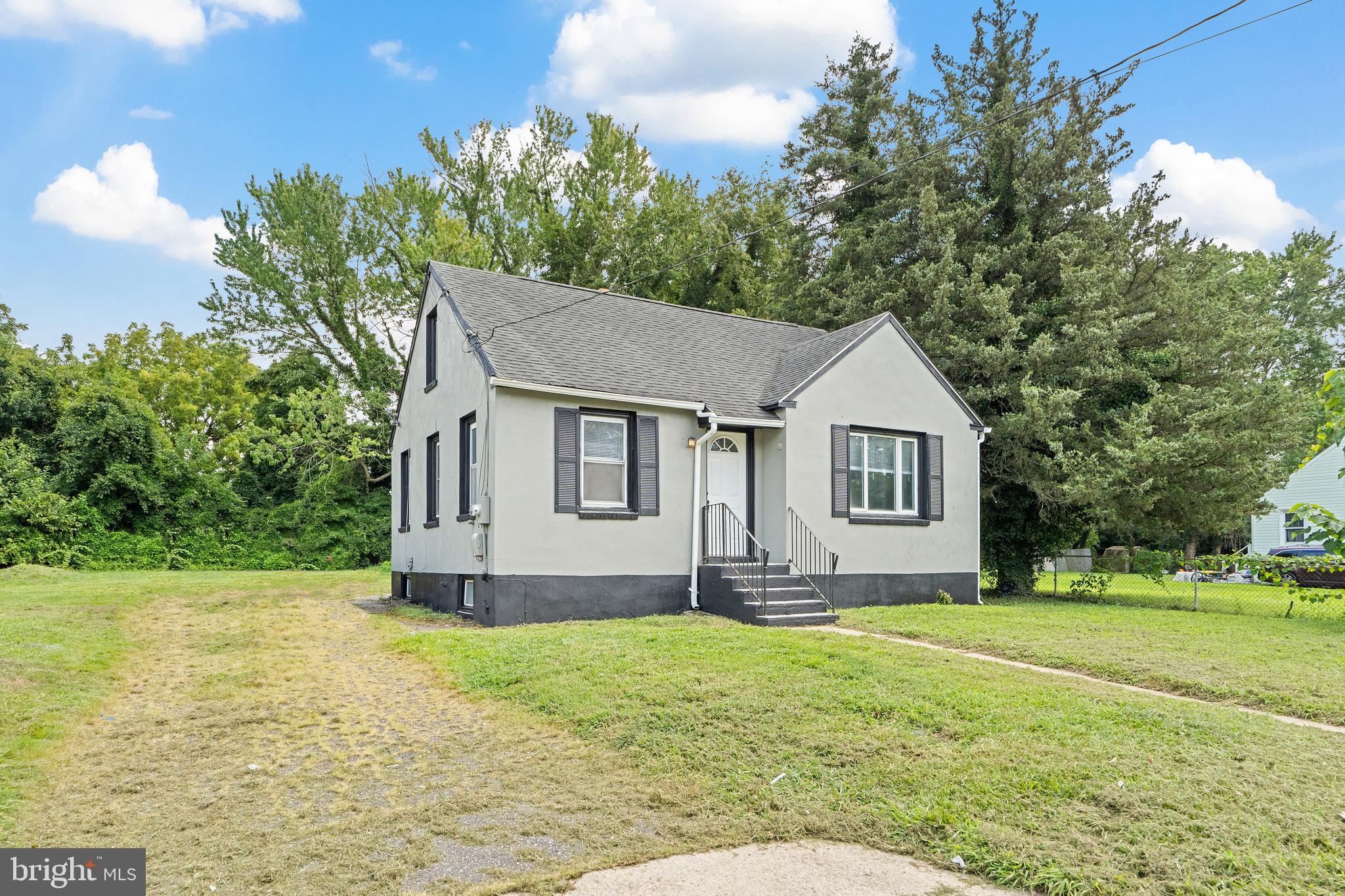 22 Davis Avenue Salem, NJ 08079 - Photo 2 of 25 a front view of a house with a yard