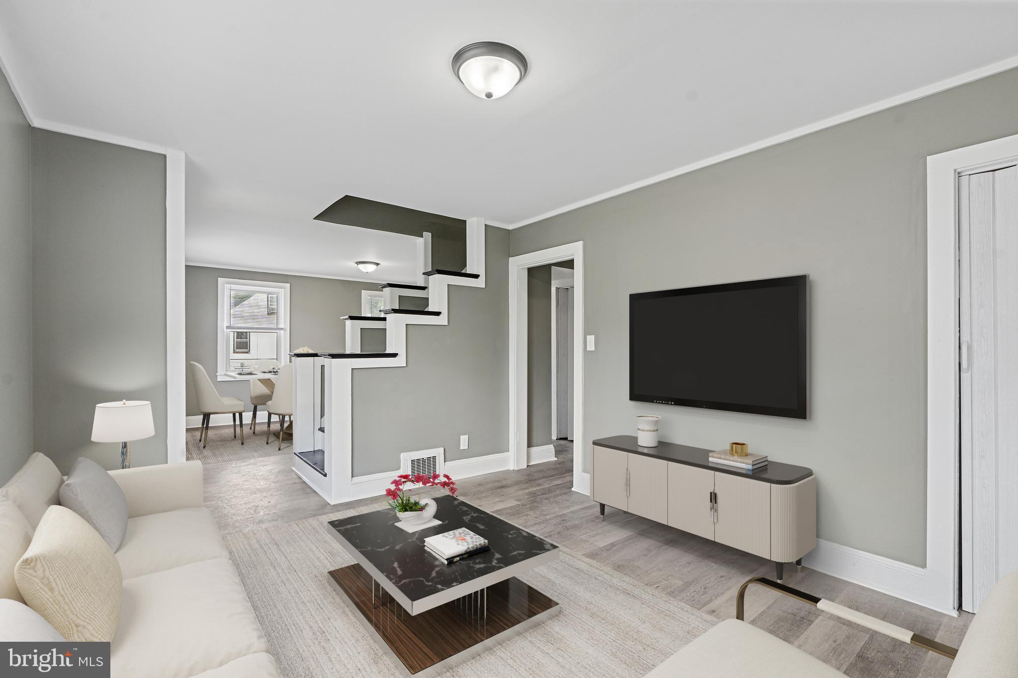 22 Davis Avenue Salem, NJ 08079 - Photo 4 of 25 a living room with furniture and a flat screen tv