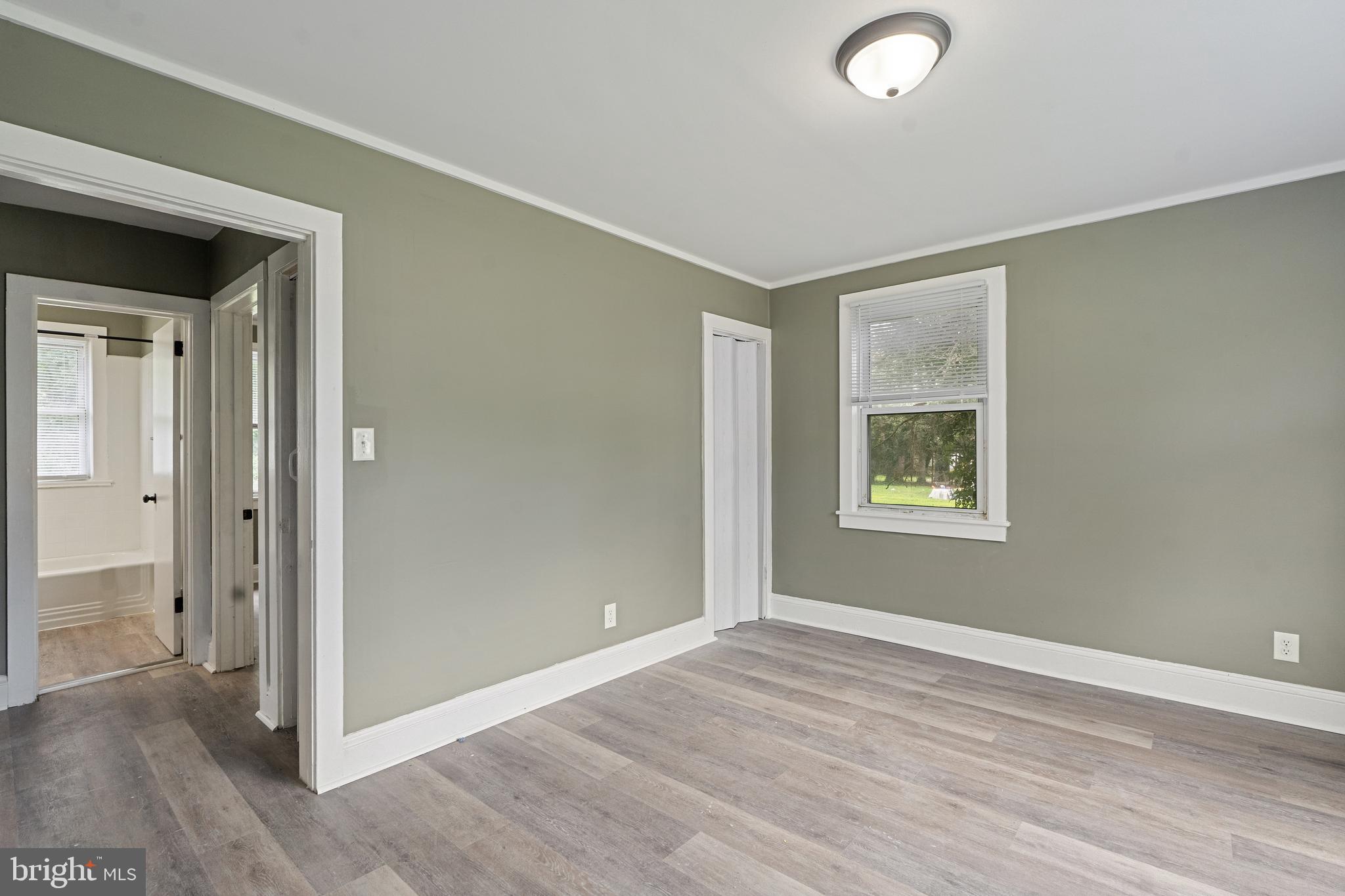 22 Davis Avenue Salem, NJ 08079 - Photo 6 of 25 an empty room with windows and closet